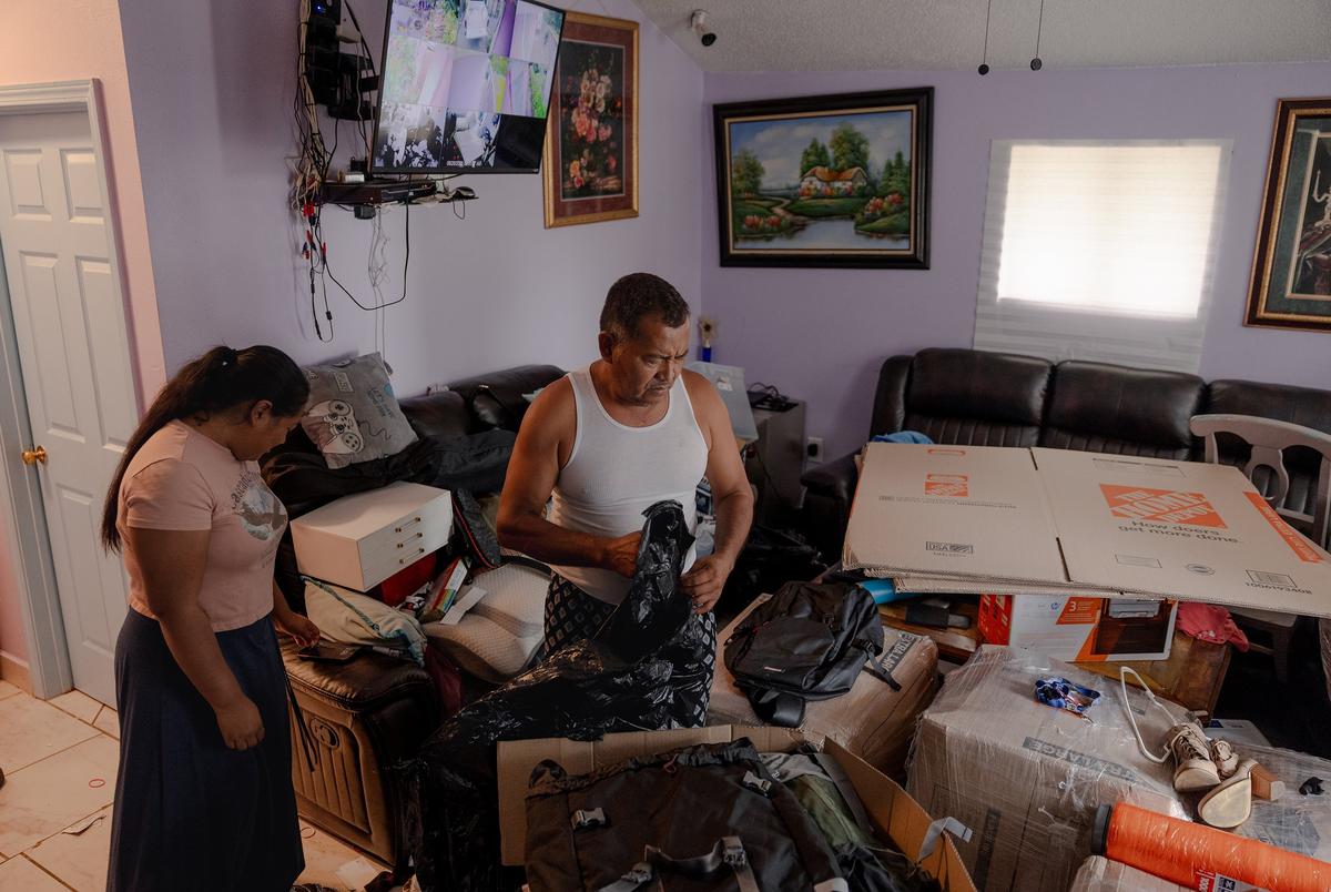 José Avila packs up boxes to send belongings to his wife, Margarita, who has been sent to her home country of Belize after signing a deportation order, Wednesday, June 25, 2025, in Houston. (Lexi Parra for The Texas Tribune)